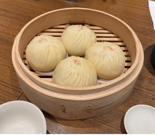 A group of dumplings in a steamer